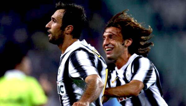 Mirko Vučinić i Andrea Pirlo; foto: La Presse