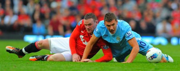 Edin Džeko u duelu s Wayneom Rooneyjem; foto: Getty Images Edin Džeko u duelu s Wayneom Rooneyjem; foto: Getty Images